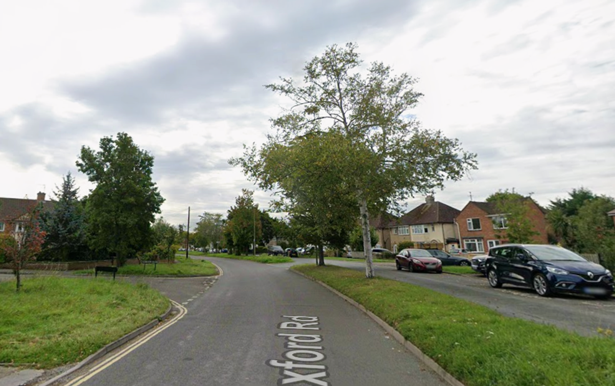 A road with trees and houses
AI-generated content may be incorrect.