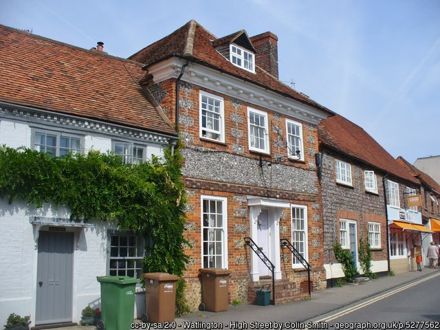 A delightful brick and stone fronted house, captured on bin day, but somehow with no traffic visible.