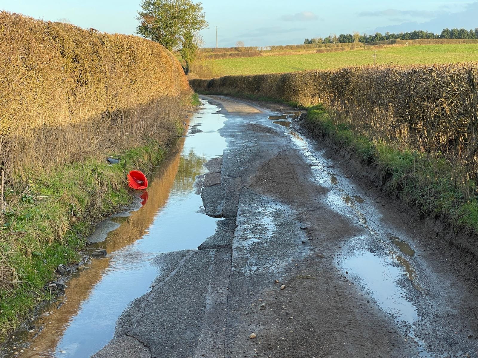 A rural road that is more pothole now than road, twisted and evil.